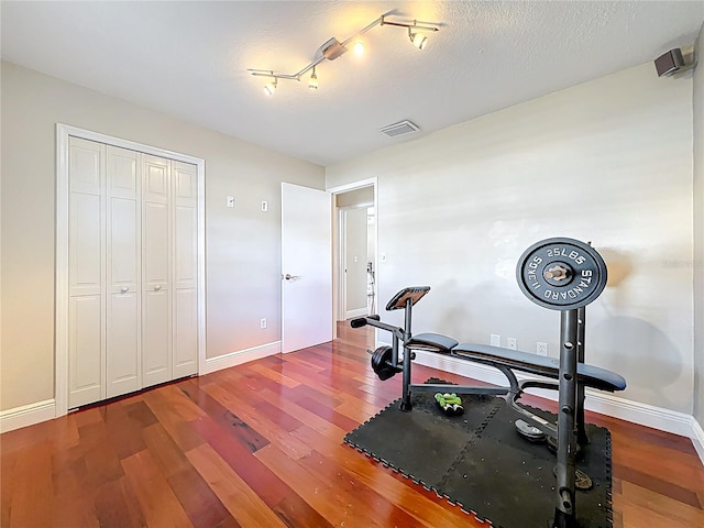 5127 Leeward Way, Orlando, FL 32809 - exercise room with wood finished floors and baseboards