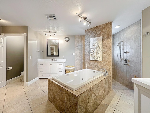 5127 Leeward Way, Orlando, FL 32809 - full bath featuring tile patterned flooring, a walk in shower, vanity, a jetted tub, and toilet