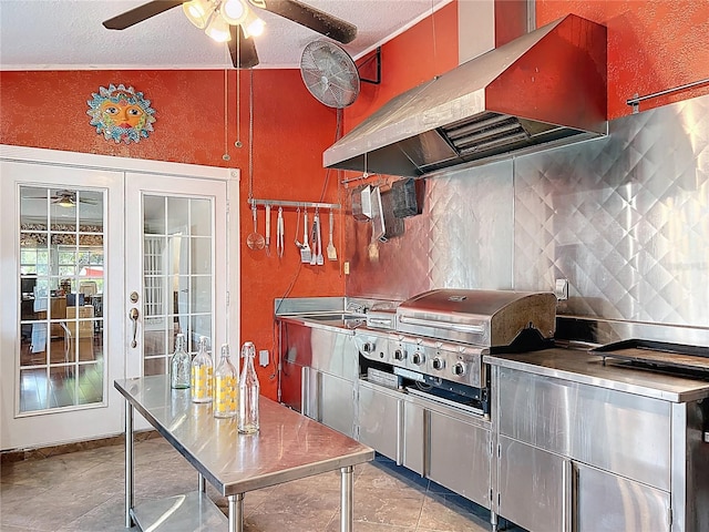 5127 Leeward Way, Orlando, FL 32809 - kitchen featuring stainless steel counters, exhaust hood, ceiling fan, backsplash, and a textured ceiling