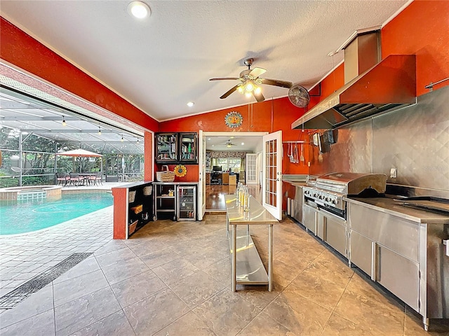 5127 Leeward Way, Orlando, FL 32809 - kitchen featuring lofted ceiling, ceiling fan, wine cooler, ventilation hood, and decorative backsplash