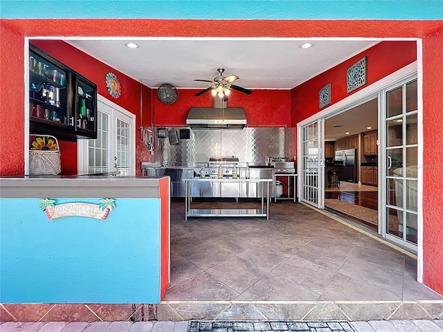5127 Leeward Way, Orlando, FL 32809 - kitchen with under cabinet range hood, freestanding refrigerator, a ceiling fan, backsplash, and recessed lighting