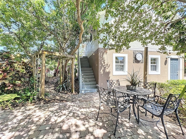 5127 Leeward Way, Orlando, FL 32809 - view of patio / terrace featuring stairs and outdoor dining space