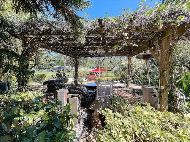 5127 Leeward Way, Orlando, FL 32809 - view of yard with a pergola