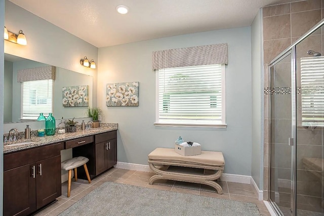 2803 Sulstone Dr, Punta Gorda, FL 33983 - bathroom featuring tile patterned floors, a shower stall, and healthy amount of natural light