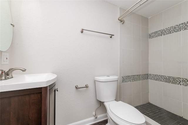 6426 Eden Ln, Tampa, FL 33634 - bathroom featuring toilet, vanity, and tiled shower