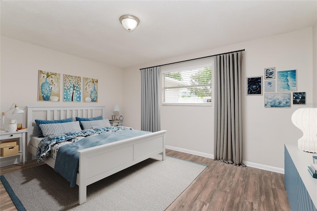6426 Eden Ln, Tampa, FL 33634 - bedroom featuring wood finished floors and baseboards