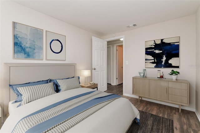 6426 Eden Ln, Tampa, FL 33634 - bedroom featuring dark wood-style floors and baseboards