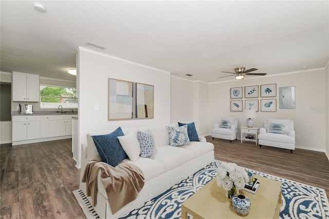 6426 Eden Ln, Tampa, FL 33634 - living room featuring dark wood finished floors, a ceiling fan, crown molding, electric panel, and baseboards