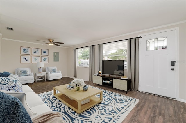 6426 Eden Ln, Tampa, FL 33634 - living area with ornamental molding, wood finished floors, ceiling fan, and baseboards