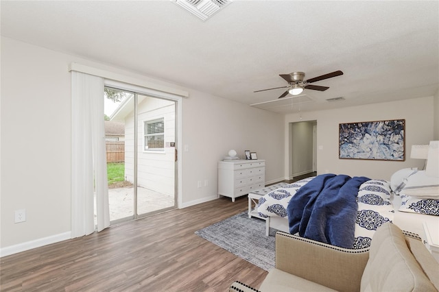 6426 Eden Ln, Tampa, FL 33634 - bedroom featuring access to outside, wood finished floors, baseboards, and a ceiling fan