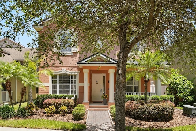 view of front facade featuring covered porch and stucco siding