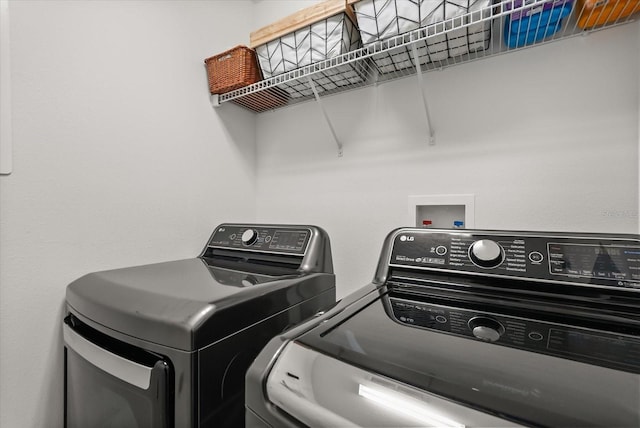 laundry room with washer and dryer