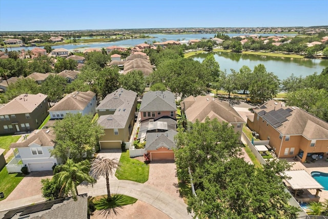aerial view of residential area featuring a nearby body of water