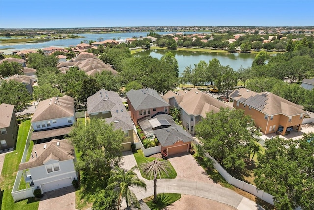 aerial view of residential area with a large body of water
