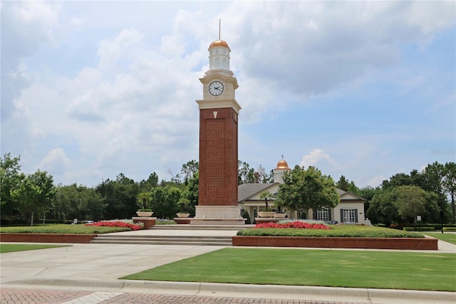 view of property's community with a yard