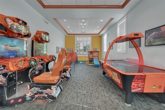 game room featuring a tray ceiling, ornamental molding, carpet floors, recessed lighting, and baseboards