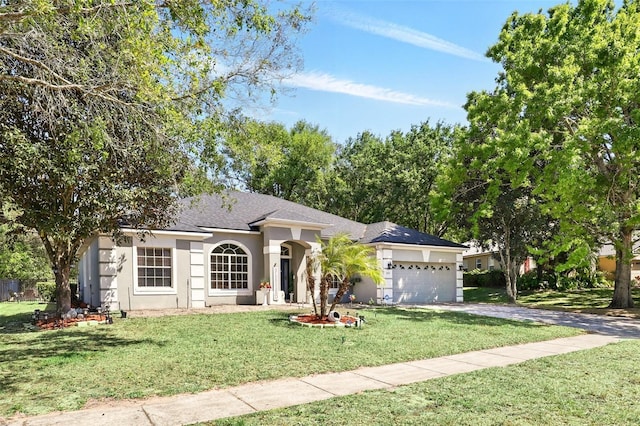 3451 Players Point Loop, Apopka, FL 32712 - single story home with concrete driveway, stucco siding, a front lawn, an attached garage, and roof with shingles