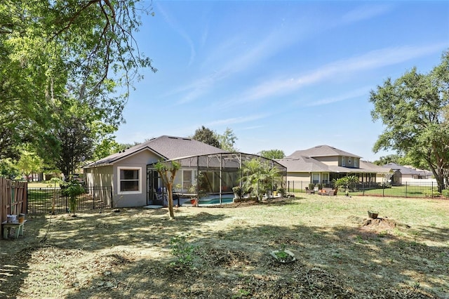 3451 Players Point Loop, Apopka, FL 32712 - fenced backyard featuring a lanai