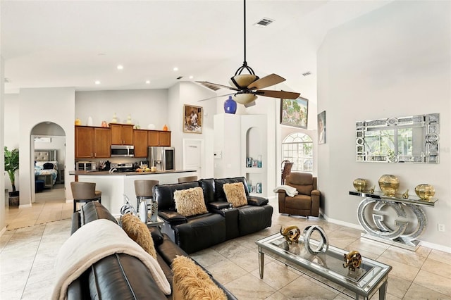 3451 Players Point Loop, Apopka, FL 32712 - living area with a ceiling fan, high vaulted ceiling, baseboards, arched walkways, and recessed lighting