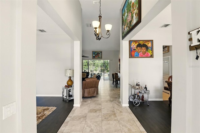 3451 Players Point Loop, Apopka, FL 32712 - hallway with a chandelier, baseboards, and light wood-type flooring