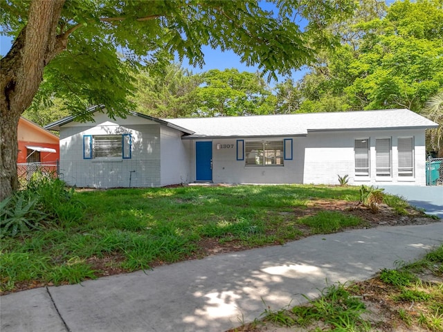 1307 Jean Ct, Eustis, FL 32726 - ranch-style home with a front yard and brick siding