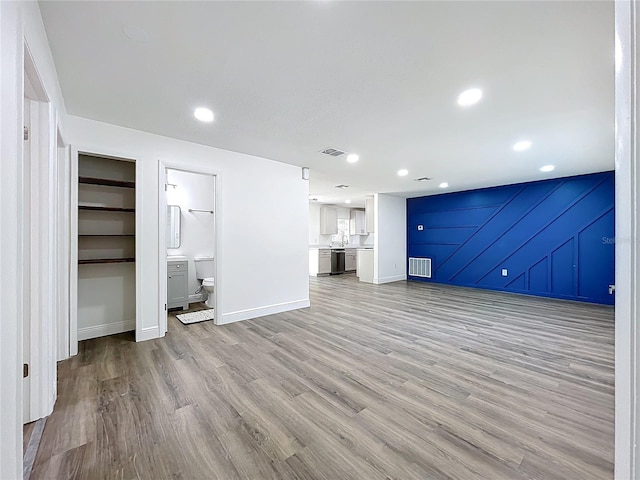 1307 Jean Ct, Eustis, FL 32726 - unfurnished living room featuring light wood-style floors, baseboards, and recessed lighting