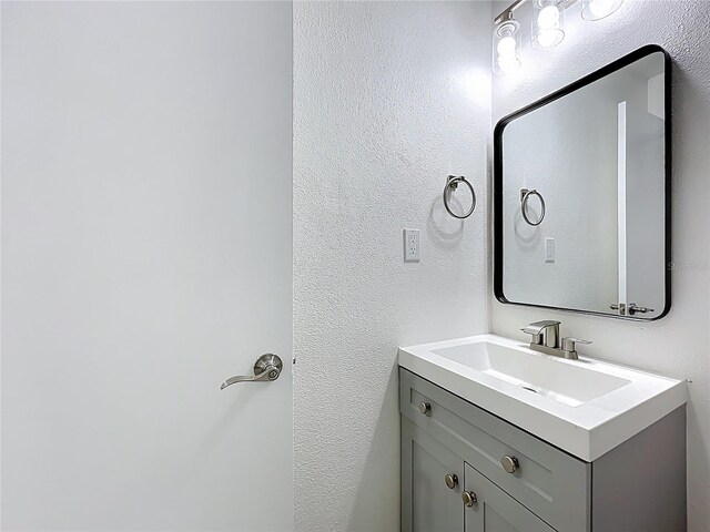 1307 Jean Ct, Eustis, FL 32726 - bathroom with vanity and a textured wall