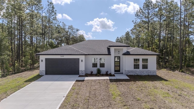 13419 SW 77th Ave, Ocala, FL 34473 - view of front of property with a garage, stucco siding, driveway, stone siding, and a front yard