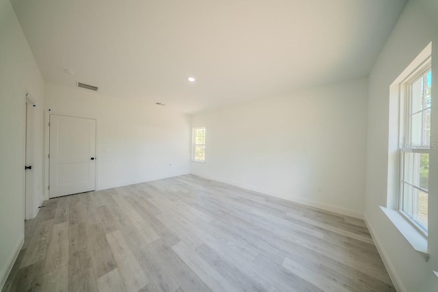 13419 SW 77th Ave, Ocala, FL 34473 - empty room with light wood-style flooring, recessed lighting, and baseboards