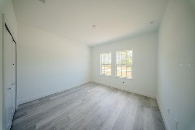13419 SW 77th Ave, Ocala, FL 34473 - unfurnished bedroom with light wood-style floors, baseboards, and a closet