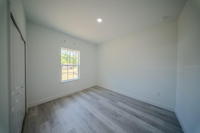 13419 SW 77th Ave, Ocala, FL 34473 - unfurnished bedroom with baseboards, wood finished floors, and a closet