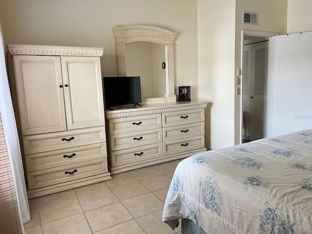 bedroom with light tile patterned flooring
