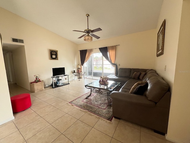 living area with ceiling fan and tile patterned floors