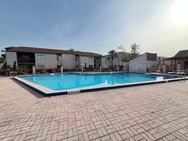 community pool featuring fence