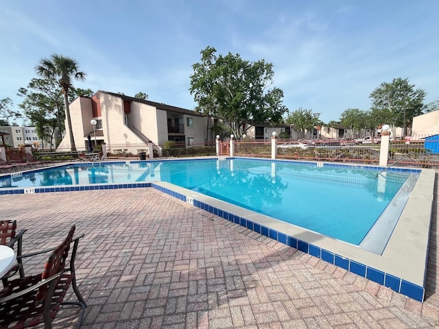 community pool featuring fence