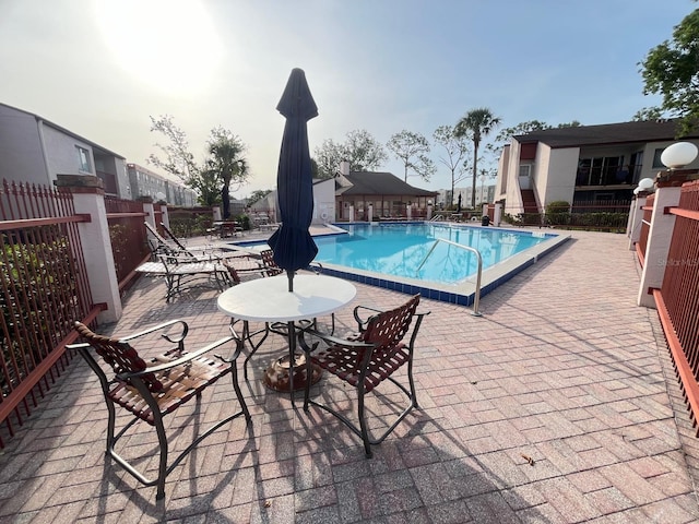 community pool with a patio