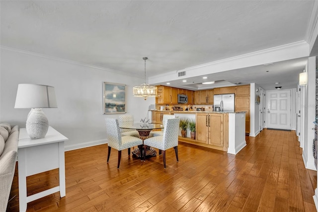 5275 S Atlantic Ave Unit 506, New Smyrna Beach, FL 32169 - dining space featuring baseboards, ornamental molding, wood-type flooring, a chandelier, and recessed lighting