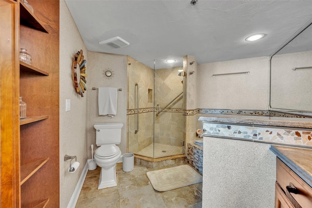 5275 S Atlantic Ave Unit 506, New Smyrna Beach, FL 32169 - bathroom featuring toilet, vanity, a stall shower, and tile patterned floors