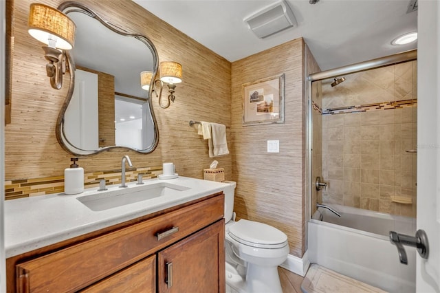 5275 S Atlantic Ave Unit 506, New Smyrna Beach, FL 32169 - full bathroom featuring toilet, tasteful backsplash, vanity, and shower / bath combination with glass door