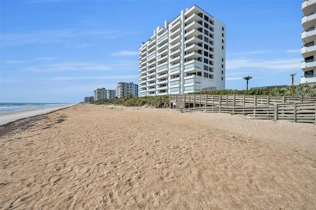 5275 S Atlantic Ave Unit 506, New Smyrna Beach, FL 32169 - view of property featuring fence and view of water and beach
