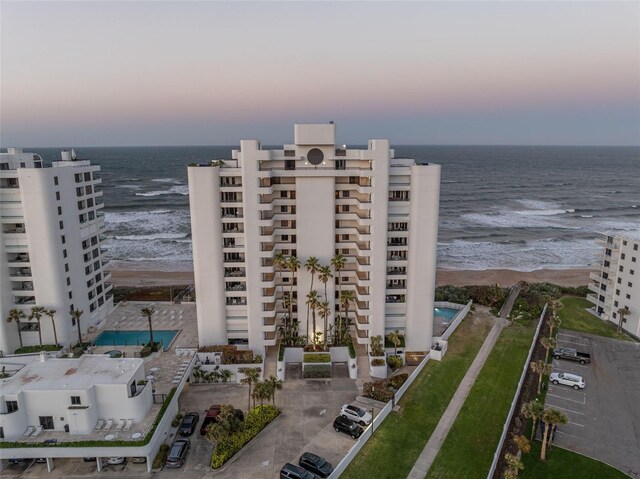 5275 S Atlantic Ave Unit 506, New Smyrna Beach, FL 32169 - property at dusk with view of water and beach