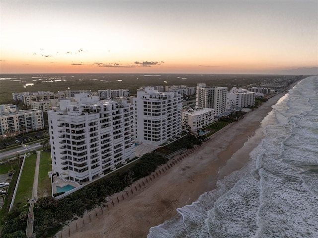 5275 S Atlantic Ave Unit 506, New Smyrna Beach, FL 32169 - drone / aerial view of waterfront with a beach