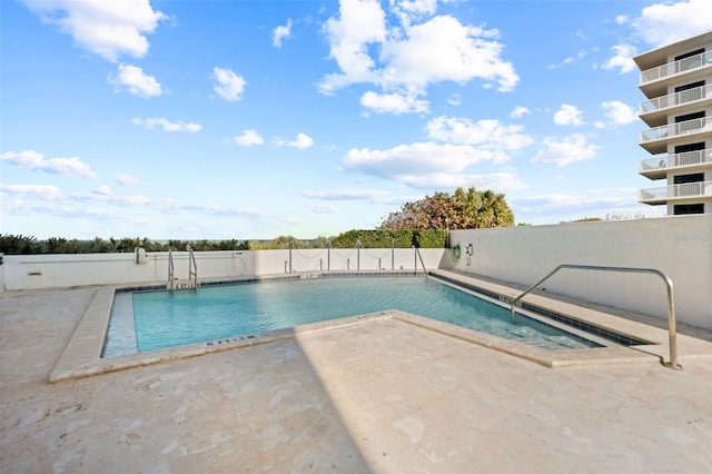 5275 S Atlantic Ave Unit 506, New Smyrna Beach, FL 32169 - community pool with a patio and fence