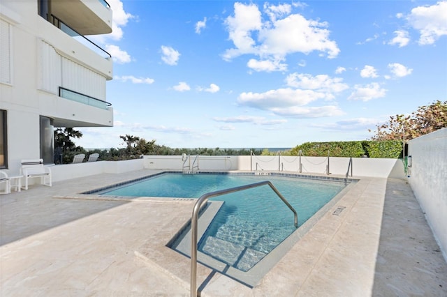 5275 S Atlantic Ave Unit 506, New Smyrna Beach, FL 32169 - community pool featuring a patio and fence