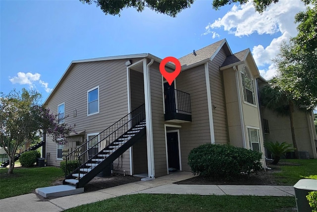 4704 Walden Cir Unit 21, Orlando, FL 32811 - view of side of property with stairs and central air condition unit