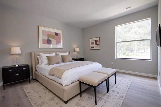4704 Walden Cir Unit 21, Orlando, FL 32811 - bedroom featuring light wood-style flooring and baseboards