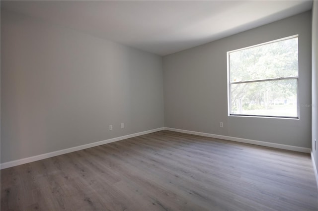 4704 Walden Cir Unit 21, Orlando, FL 32811 - spare room with wood finished floors and baseboards