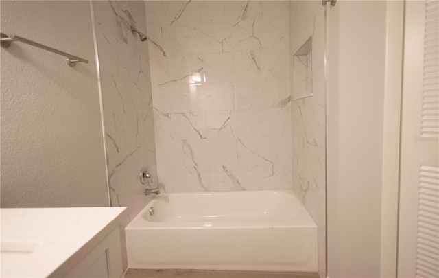 4704 Walden Cir Unit 21, Orlando, FL 32811 - bathroom featuring tub / shower combination, vanity, and a textured wall