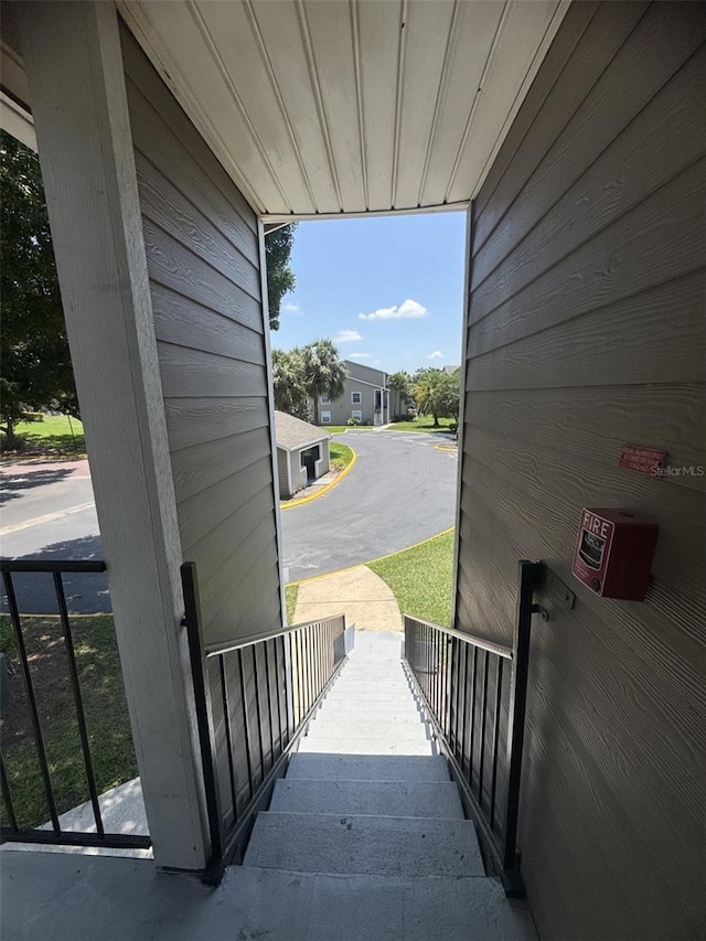 4704 Walden Cir Unit 21, Orlando, FL 32811 - doorway with healthy amount of natural light and wooden walls