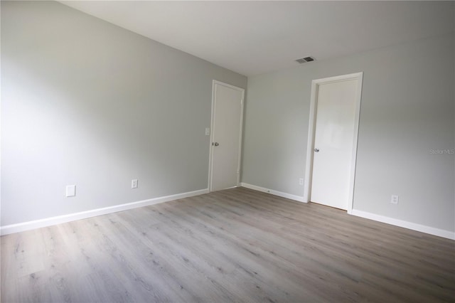 4704 Walden Cir Unit 21, Orlando, FL 32811 - unfurnished room with wood finished floors and baseboards